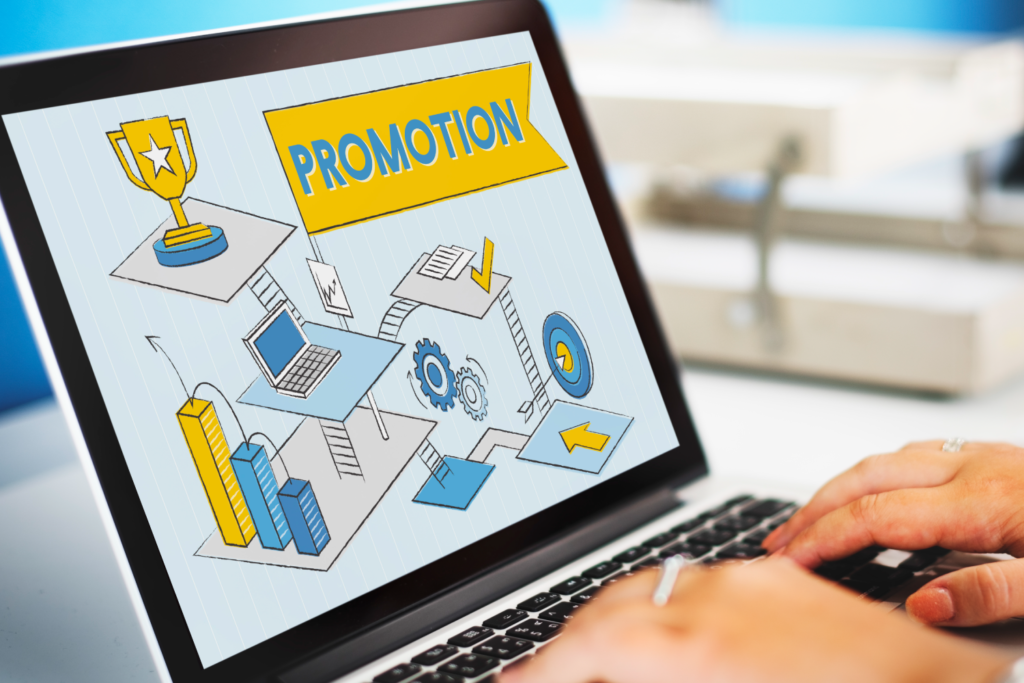 Laptop screen displaying digital marketing graphics with the word "Promotion," illustrating strategies on how to market digital products.