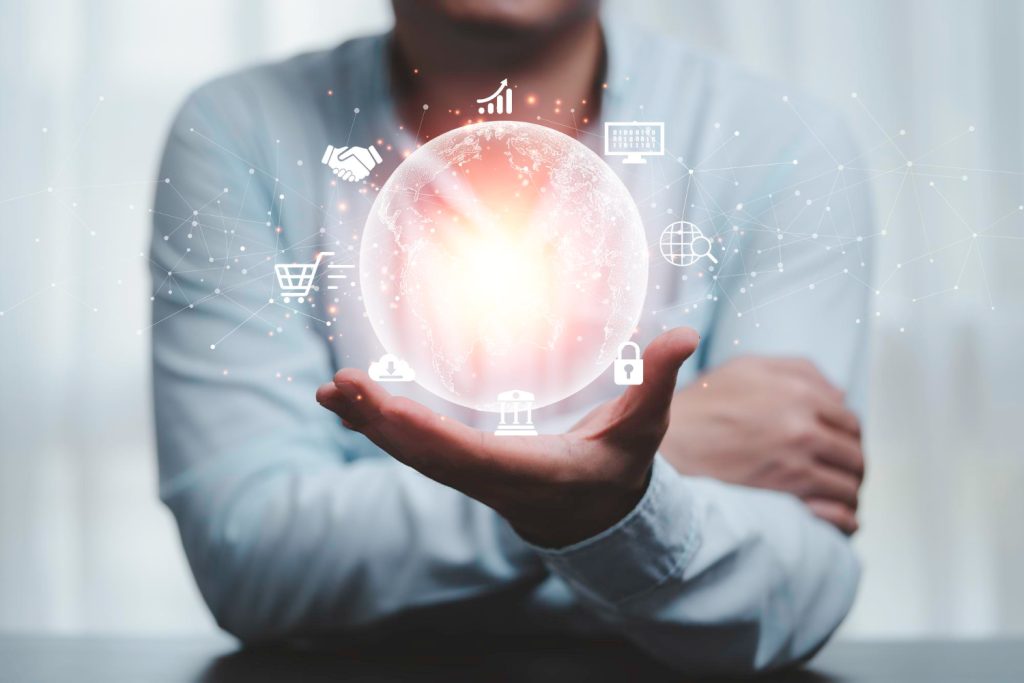 Close-up of a person holding a glowing globe with digital icons representing SEO and online marketing concepts, symbolizing the expertise of an SEO consultant.